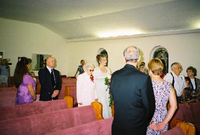 Carlenes mom walking her down the aisle